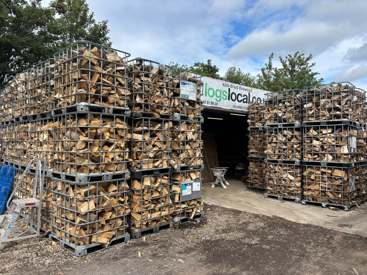 Logs stacked in crates at the yard